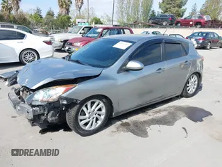 2012 Mazda Mazda3 i Touring with VIN JM1BL1L89C1558242, listed as a IAAI auction lot 42057513 with 112,094 mi miles. Bid and sale history available at carsss.com. Image 2.