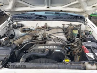 1999 Toyota Tacoma with VIN 4TAWN72N6XZ452890, listed as a IAAI auction lot 41485263 with 201,974 mi miles and . Bid and sale history available at DreamBid. Image 10.