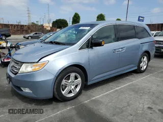 2012 Honda Odyssey Touring с VIN 5FNRL5H9XCB112552, выставлен на аукционе Copart как лот 58061875 с пробегом 125 619 миль миль и Списание • Salvage title. История ставок и продаж доступна на DreamBid. Изображение 1.