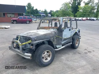 2000 Jeep Wrangler Sport with VIN 1J4FA49S5YP797345, listed as a IAAI auction lot 40322775 with Not Provided miles and . Bid and sale history available at DreamBid. Image 2.