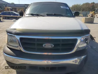 2000 Ford F-150 XL with VIN 1FTRX18W2YNC34320, listed as a Copart auction lot 77832404 with 217,448 mi miles and Clean Title. Bid and sale history available at carsss.com. Image 5.