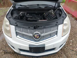 2010 Cadillac SRX Premium Collection z VIN 3GYFNCEY4AS569787, wystawiony jako IAAI lot #42524167 z przebiegiem 222 000 mil mil oraz . Historia ofert i sprzedaży dostępna na DreamBid. Obrazek 10.
