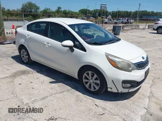 2013 Kia Rio SX with VIN KNADN4A33D6174454, listed as a IAAI auction lot 42032612 with 157,199 mi miles. Bid and sale history available at carsss.com. Image 1.