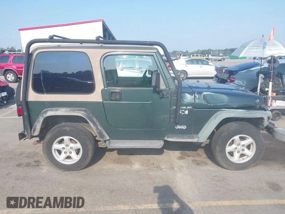 2002 Jeep Wrangler X with VIN 1J4FA39S72P733034, listed as a IAAI auction lot 42659447 with 200,786 mi miles and . Bid and sale history available at DreamBid. Image 13.