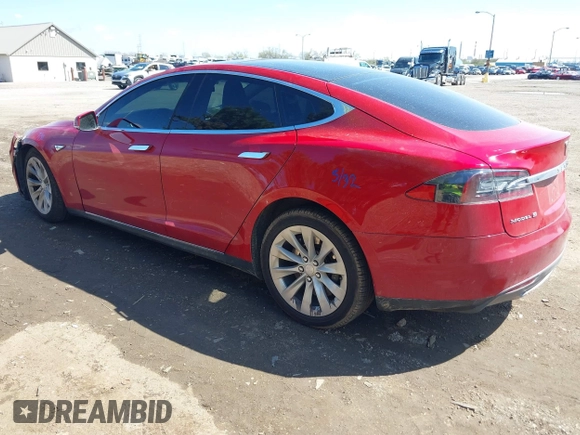 2014 Tesla Model S 60 with VIN 5YJSA1H11EFP37791, listed as a IAAI auction lot 41995504 with 84,371 mi miles and . Bid and sale history available at DreamBid. Image 3.