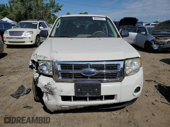 2009 Ford Escape XLS z VIN 1FMCU02779KB08396, wystawiony jako Copart lot #80984104 z przebiegiem 194 743 mil mil oraz Szkoda całkowita • Salvage title. Historia ofert i sprzedaży dostępna na DreamBid. Obrazek 5.
