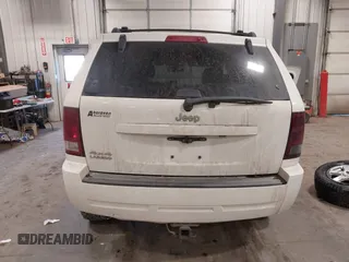 2010 Jeep Grand Cherokee Laredo with VIN 1J4PR4GK7AC126059, listed as a IAAI auction lot 41599058 with 154,192 mi miles. Bid and sale history available at carsss.com. Image 17.