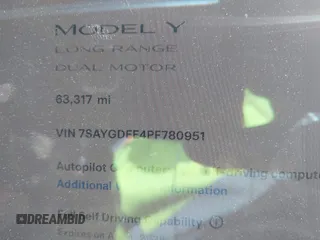 2023 Tesla Model Y Long Range with VIN 7SAYGDEE4PF780951, listed as a IAAI auction lot 41856461 with 63,317 mi miles. Bid and sale history available at carsss.com. Image 7.
