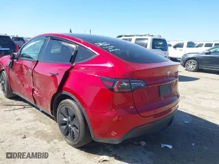 2024 Tesla Model Y with VIN 7SAYGDED6RA300819, listed as a IAAI auction lot 41769635 with 11,812 mi miles. Bid and sale history available at carsss.com. Image 3.