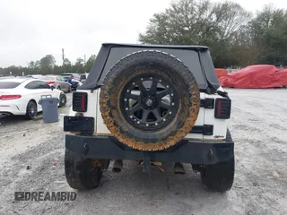 2014 Jeep Wrangler Unlimited Sahara with VIN 1C4BJWEG0EL151473, listed as a IAAI auction lot 41600726 with 119,057 mi miles. Bid and sale history available at carsss.com. Image 16.
