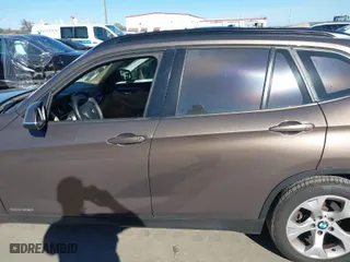 2013 BMW X1 28i with VIN WBAVM1C5XDVW42366, listed as a IAAI auction lot 38457662 with 107,116 mi miles. Bid and sale history available at carsss.com. Image 15.