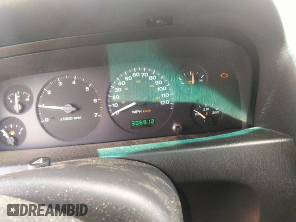 2004 Jeep Grand Cherokee Laredo z VIN 1J4GW48SX4C309998, wystawiony jako IAAI lot #42307167 z przebiegiem 306 912 mil mil oraz . Historia ofert i sprzedaży dostępna na DreamBid. Obrazek 7.