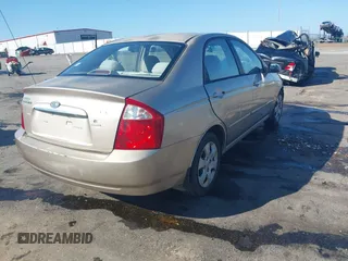 2004 Kia Spectra LX with VIN KNAFE121745039519, listed as a IAAI auction lot 41482402 with 201,123 mi miles. Bid and sale history available at carsss.com. Image 4.
