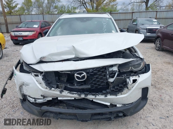2023 Mazda CX-50 S Premium Plus with VIN 7MMVABEM7PN108865, listed as a IAAI auction lot 42049215 with 33,285 mi miles and . Bid and sale history available at DreamBid. Image 12.