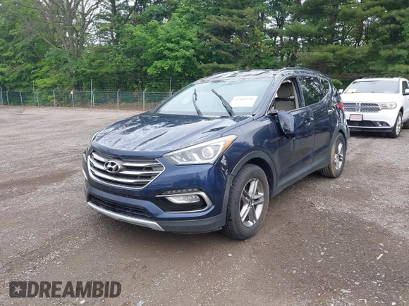 2017 Hyundai Santa Fe 2.4L z VIN 5XYZUDLB9HG421284, wystawiony jako IAAI lot #42441436 z przebiegiem 96 155 mil mil oraz . Historia ofert i sprzedaży dostępna na DreamBid. Obrazek 2.