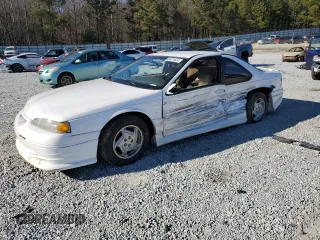 1997 Ford Thunderbird LX with VIN 1FALP62W0VH150654, listed as a Copart auction lot 86274524 with 119,203 mi miles and Salvage Title. Bid and sale history available at DreamBid. Image 1.