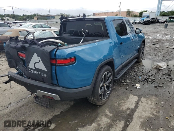 2023 Rivian R1T Adventure with VIN 7FCTGBAA5PN026063, listed as a Copart auction lot 66916194 with Not Provided miles and Salvage Title. Bid and sale history available at DreamBid. Image 3.