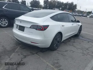 2021 Tesla Model 3 Long Range with VIN 5YJ3E1EB6MF878957, listed as a IAAI auction lot 41915482 with 59,578 mi miles. Bid and sale history available at carsss.com. Image 4.