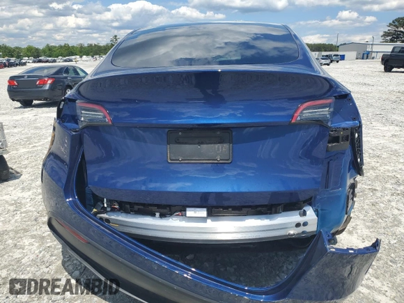 2022 Tesla Model Y Long Range z VIN 7SAYGDEE4NF426893, wystawiony jako Copart lot #55809275 z przebiegiem 16 083 mil mil oraz Szkoda całkowita • Salvage title. Historia ofert i sprzedaży dostępna na DreamBid. Obrazek 6.