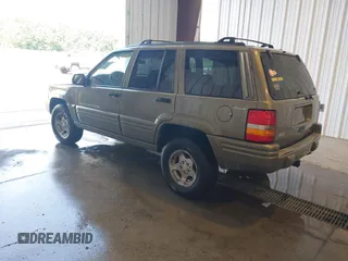 1998 Jeep Grand Cherokee Laredo with VIN 1J4GZ48S4WC262249, listed as a IAAI auction lot 42739473 with 94,094 mi miles and . Bid and sale history available at DreamBid. Image 3.