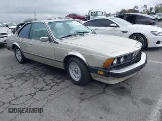 1985 BMW 6 Series 635CSi with VIN WBAEC8400F0610637, listed as a IAAI auction lot 41935412 with 129,943 mi miles. Bid and sale history available at carsss.com. Image 1.