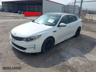 2016 Kia Optima EX with VIN 5XXGU4L38GG013197, listed as a IAAI auction lot 42125301 with 110,128 mi miles. Bid and sale history available at carsss.com. Image 2.