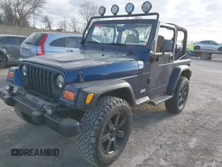 2001 Jeep Wrangler Sport with VIN 1J4FA49S41P334053, listed as a IAAI auction lot 41884967 with 158,258 mi miles. Bid and sale history available at carsss.com. Image 2.