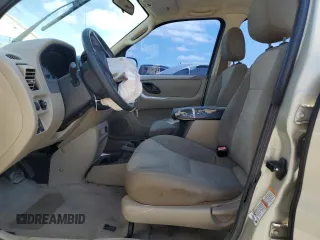 2004 Ford Escape with VIN 1FMCU02194DA23228, listed as a Copart auction lot 72161464 with 167,233 mi miles and Salvage title. Bid and sale history available at DreamBid. Image 7.