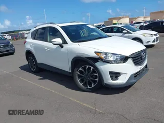 2016 Mazda CX-5 Grand Touring z VIN JM3KE2DY0G0859855, wystawiony jako IAAI lot #42099250 z przebiegiem 91 583 mil mil oraz . Historia ofert i sprzedaży dostępna na DreamBid. Obrazek 1.