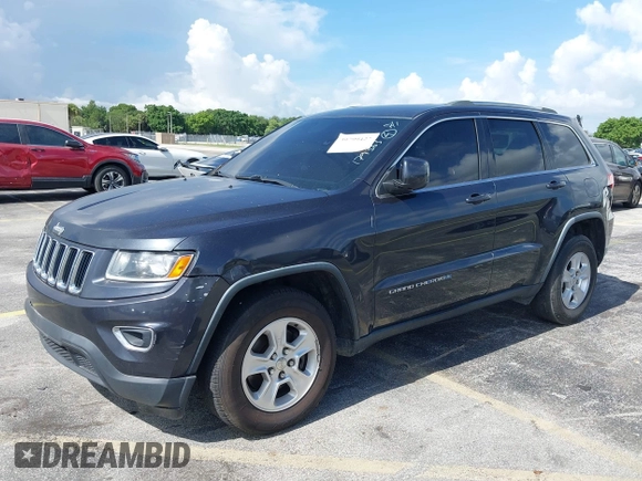 2014 Jeep Grand Cherokee Laredo with VIN 1C4RJEAG0EC179563, listed as a IAAI auction lot 39799427 with 209,169 mi miles and . Bid and sale history available at DreamBid. Image 2.