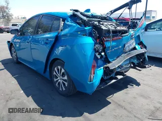 2021 Toyota Prius LE with VIN JTDKAMFP7M3169633, listed as a IAAI auction lot 41986170 with 55,925 mi miles and . Bid and sale history available at DreamBid. Image 3.