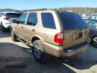 2001 Isuzu Rodeo S with VIN 4S2CK58W414322118, listed as a IAAI auction lot 41496624 with 244,189 mi miles and . Bid and sale history available at DreamBid. Image 3.