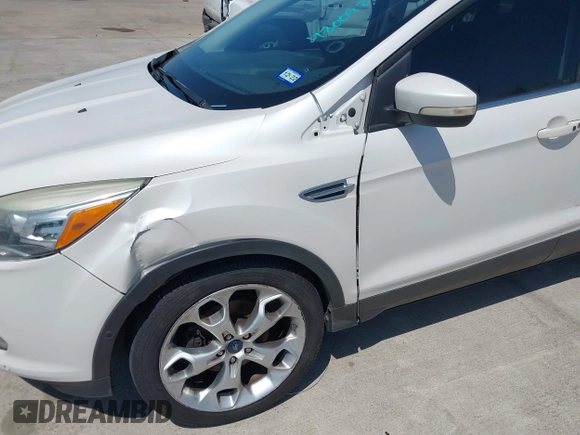 2013 Ford Escape Titanium with VIN 1FMCU0J9XDUA33872, listed as a IAAI auction lot 42009286 with 161,677 mi miles. Bid and sale history available at carsss.com. Image 6.