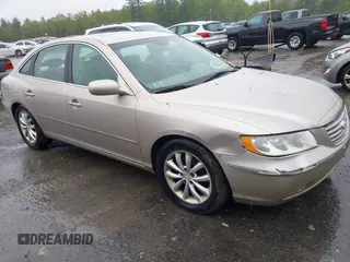 2006 Hyundai Azera SE z VIN KMHFC46F76A134958, wystawiony jako IAAI lot #42314943 z przebiegiem 206 745 mil mil oraz . Historia ofert i sprzedaży dostępna na DreamBid. Obrazek 1.
