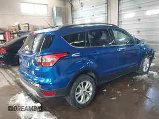 2018 Ford Escape SE z VIN 1FMCU9GD1JUB80500, wystawiony jako IAAI lot #41613294 z przebiegiem 112 187 mil mil oraz . Historia ofert i sprzedaży dostępna na DreamBid. Obrazek 4.