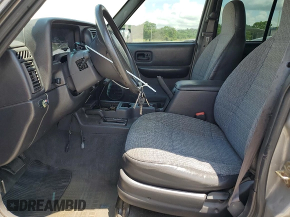 2000 Jeep Cherokee SE with VIN 1J4FF28SXYL140930, listed as a Copart auction lot 59191035 with 248,598 mi miles and Salvage title. Bid and sale history available at DreamBid. Image 7.