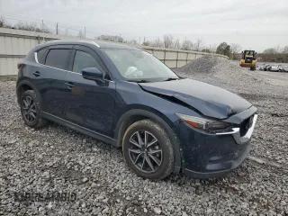 2017 Mazda CX-5 Grand Touring with VIN JM3KFADL3H0125143, listed as a Copart auction lot 50178005 with 160,058 mi miles and Salvage Title. Bid and sale history available at carsss.com. Image 4.