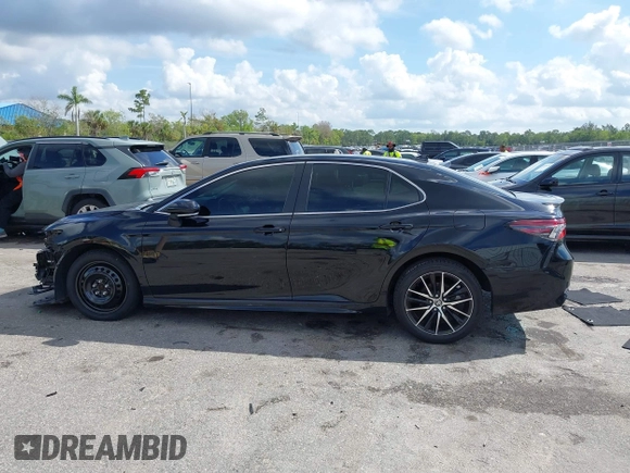 2023 Toyota Camry SE with VIN 4T1G11AK6PU741172, listed as a IAAI auction lot 41599909 with 56,668 mi miles and . Bid and sale history available at DreamBid. Image 14.