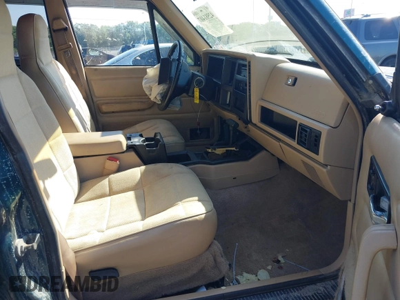1995 Jeep Cherokee Sport z VIN 1J4FJ68S7SL623451, wystawiony jako IAAI lot #42581407 z przebiegiem 160 581 mil mil oraz . Historia ofert i sprzedaży dostępna na DreamBid. Obrazek 5.