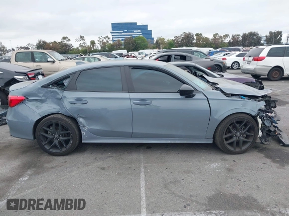 2022 Honda Civic Sport z VIN 2HGFE2F53NH595327, wystawiony jako IAAI lot #41993766 z przebiegiem 26 516 mil mil oraz . Historia ofert i sprzedaży dostępna na DreamBid. Obrazek 13.