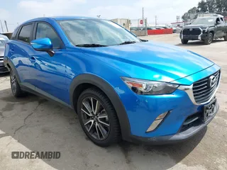 2017 Mazda CX-3 Touring z VIN JM1DKFC77H0148553, wystawiony jako IAAI lot #42218580 z przebiegiem 110 308 mil mil oraz . Historia ofert i sprzedaży dostępna na DreamBid. Obrazek 1.