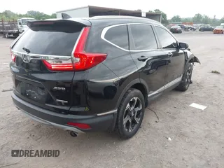2017 Honda CR-V Touring with VIN 2HKRW2H96HH672017, listed as a IAAI auction lot 42151118 with 144,527 mi miles and . Bid and sale history available at carsss.com. Image 4.