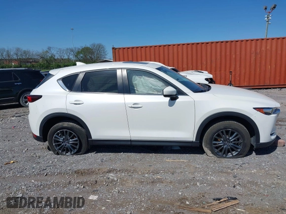 2021 Mazda CX-5 Touring z VIN JM3KFBCM2M1395663, wystawiony jako IAAI lot #41948073 z przebiegiem 47 029 mil mil oraz . Historia ofert i sprzedaży dostępna na DreamBid. Obrazek 13.
