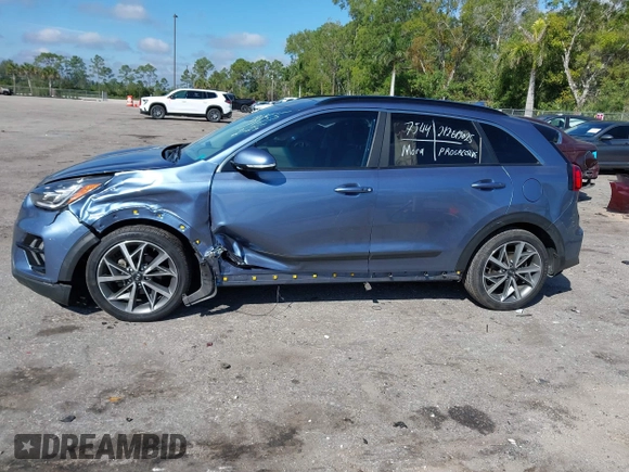 2021 Kia Niro Touring with VIN KNDCC3LC3M5483455, listed as a IAAI auction lot 41678795 with 132,216 mi miles. Bid and sale history available at carsss.com. Image 6.