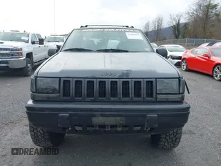 1995 Jeep Grand Cherokee Laredo with VIN 1J4GZ58S4SC778322, listed as a IAAI auction lot 41498800 with 255,058 mi miles. Bid and sale history available at carsss.com. Image 13.