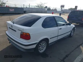 1996 BMW 3-Series 318TI with VIN WBACG8324TAU36317, listed as a IAAI auction lot 41489402 with 139,956 mi miles. Bid and sale history available at carsss.com. Image 4.