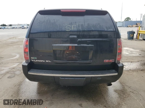 2012 GMC Yukon XL Denali with VIN 1GKS1MEF9CR323090, listed as a Copart auction lot 71675214 with 143,408 mi miles and Salvage Title. Bid and sale history available at carsss.com. Image 6.