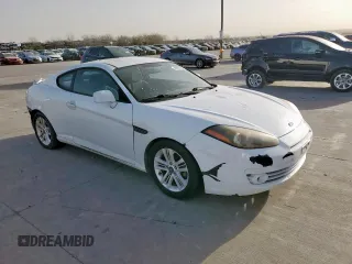 2007 Hyundai Tiburon GS z VIN KMHHM66D27U260421, wystawiony jako Copart lot #48982505 z przebiegiem 100 045 mil mil oraz Tytuł czysty. Historia ofert i sprzedaży dostępna na DreamBid. Obrazek 4.
