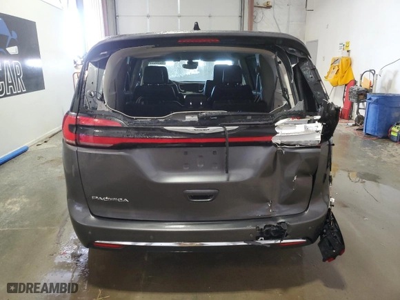 2023 Chrysler Pacifica Touring L with VIN 2C4RC1BG9PR550490, listed as a Copart auction lot 52802995 with 57,942 mi miles and Clean Title. Bid and sale history available at carsss.com. Image 6.