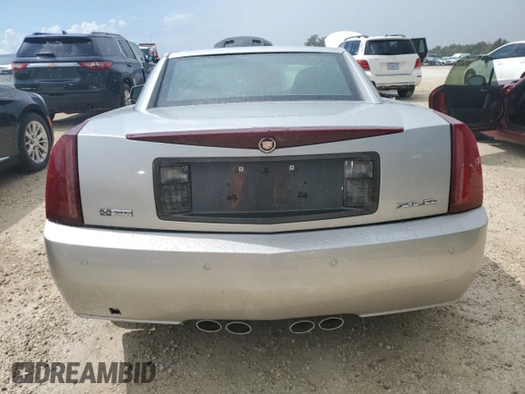 2006 Cadillac XLR z VIN 1G6YV36A365601441, wystawiony jako Copart lot #73945994 z przebiegiem Nie podano mil oraz Szkody całkowita. Historia ofert i sprzedaży dostępna na DreamBid. Obrazek 6.